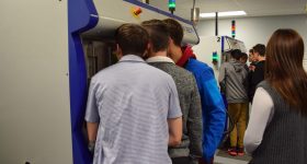 Students captivated by the laser sintering process; it’s quite elegant to watch.