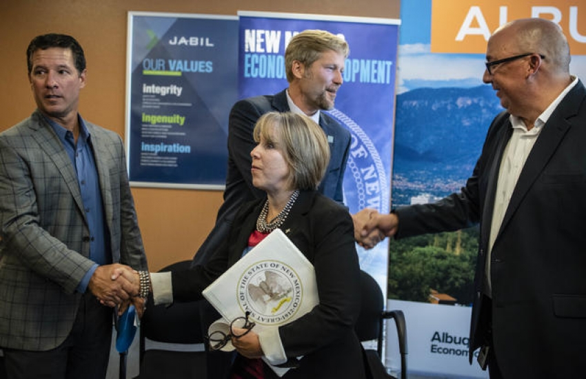 From left to right: Jabil CEO and VP Steve Borges, Gov. Michelle Lujan Grisham, Albuquerque Mayor Tim Keller, (background), and John Silva, General Manager of the Albuquerque Facility. Photo by Roberto E. Rosales/Albuquerque Journal
