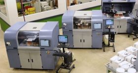 特色图片显示a line of ExOne's 3D printers that have been installed by a client in North America. Photo via ExOne.