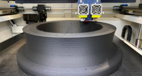 3 d Metalforge打印机打印一个大型格式标准t in PACF. Photo via 3D Metalforge.