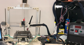 这researchers' prototype gantry-mounted WAAM 3D printer.