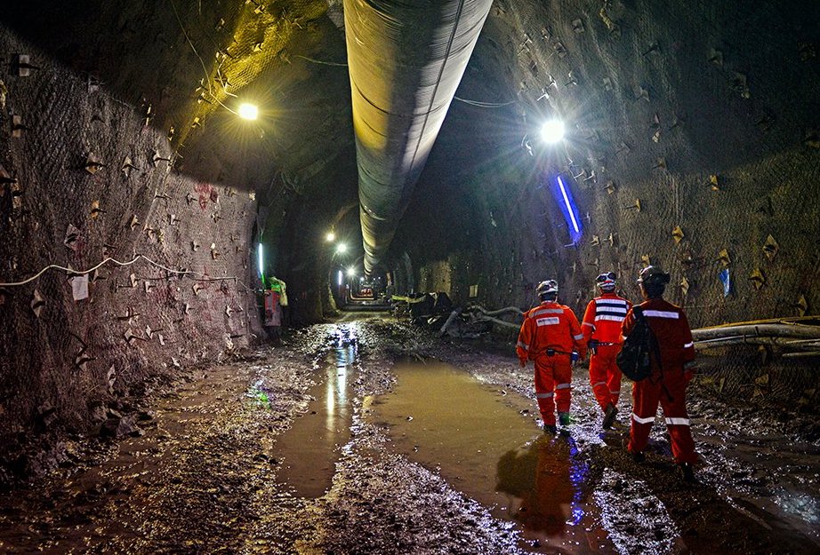 Sandvik engineers walking through an underground mining facility. Photo via Sandvik Mining and Rock Solutions.