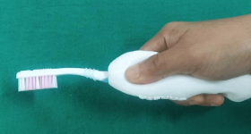The researchers' 3D printed toothbrush handle. Photo via MNR Dental College and Hospital.
